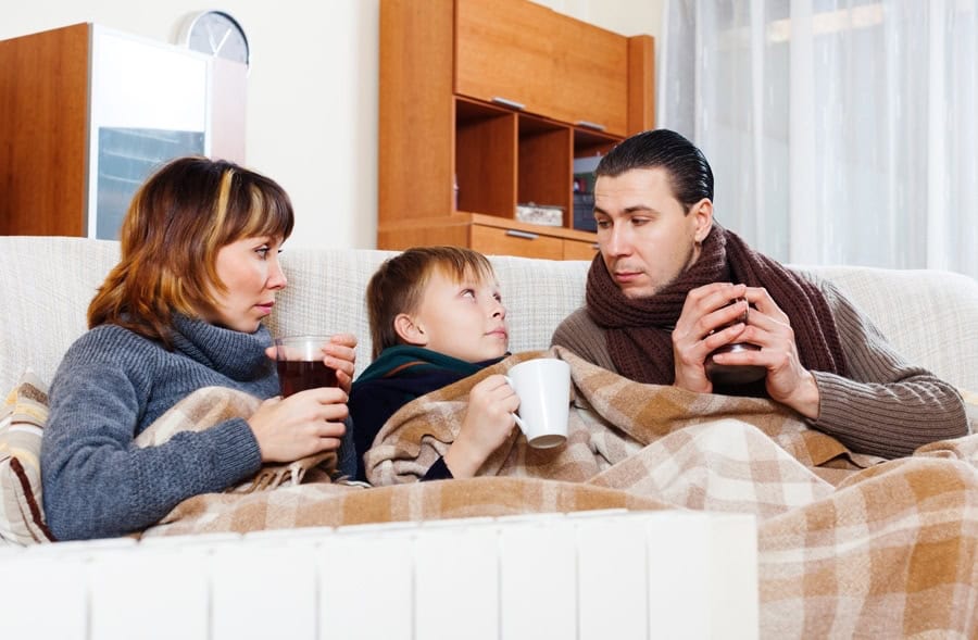 Cold family trying to stay warm and determining that it's time for a new furnace.