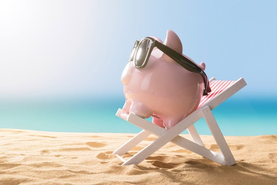 Piggy bank on the beach representing the financing options available for affording a new AC system and other HVAC equipment for your home.