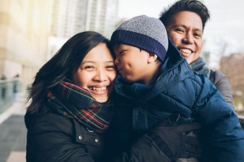 Is Your Heating System Ready for This Winter? - Family Bundled up in Winter Clothes Outside.